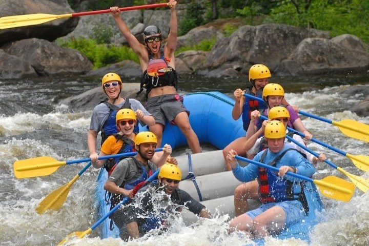 a group of people on a raft in a pool of water